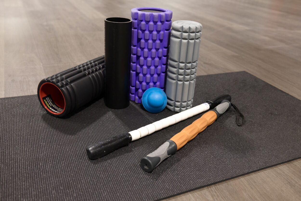 Foam rollers and massage tools used for active recovery and muscle soreness relief